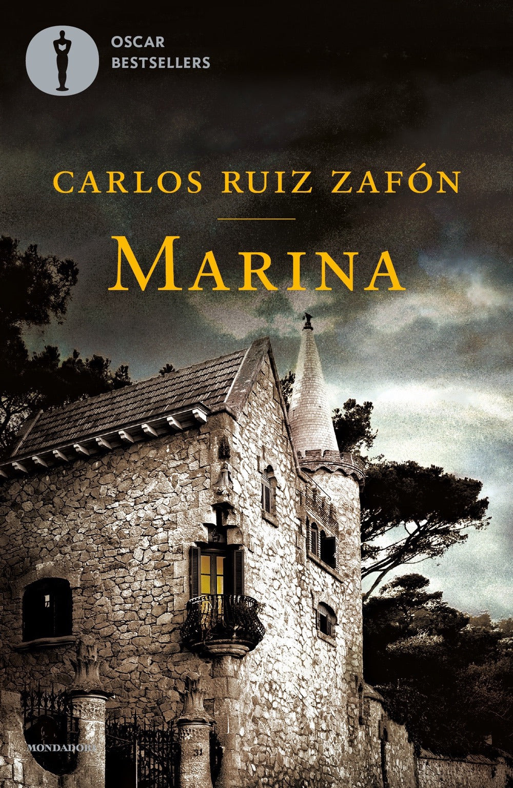 Book cover of 'Marina' by Carlos Ruiz Zafón with a stone building and tree in the background.
