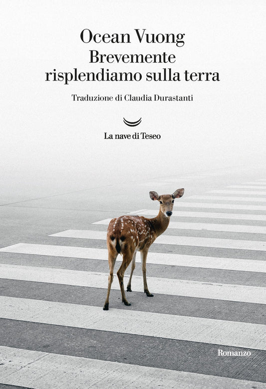 Book cover with a deer on a zebra crossing, featuring text about Ocean Vuong's work.